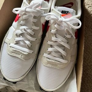 Brand new, never worn Nikes. Womens size 8.5 and mens 7.